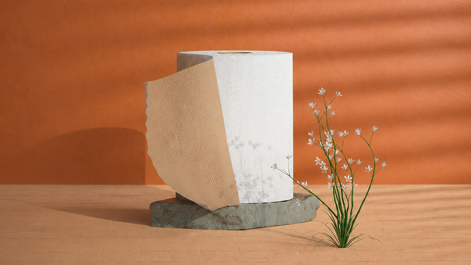 Un rouleau d’essuie-tout posé sur une pierre, contre un mur terracotta
