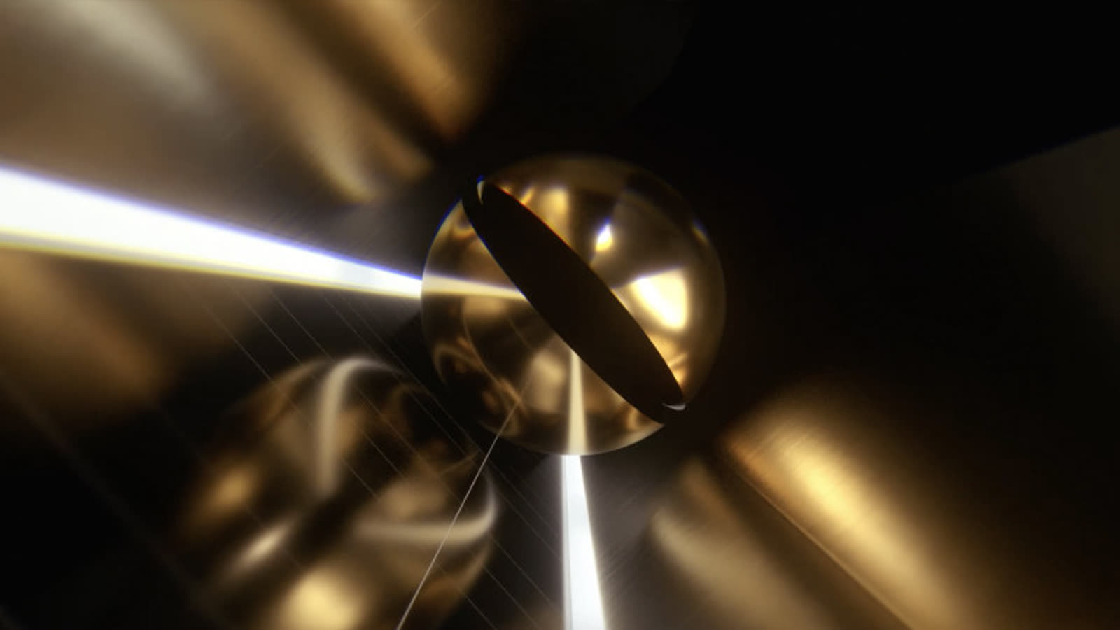 Gros plan sur la sphère dorée traversée d’un trait de lumière